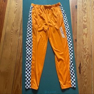 Pleasures orange checkered track pants